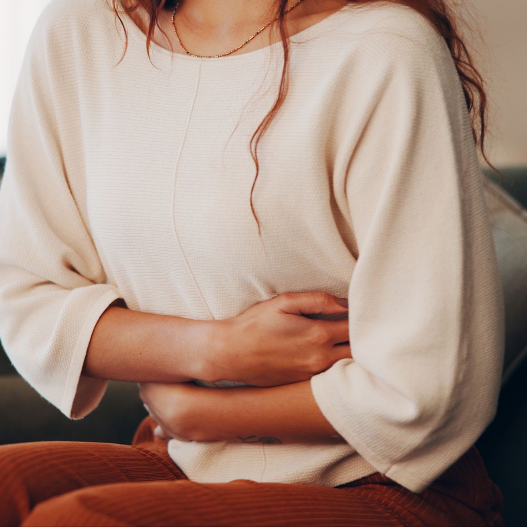 person suffering with IBS and bloating